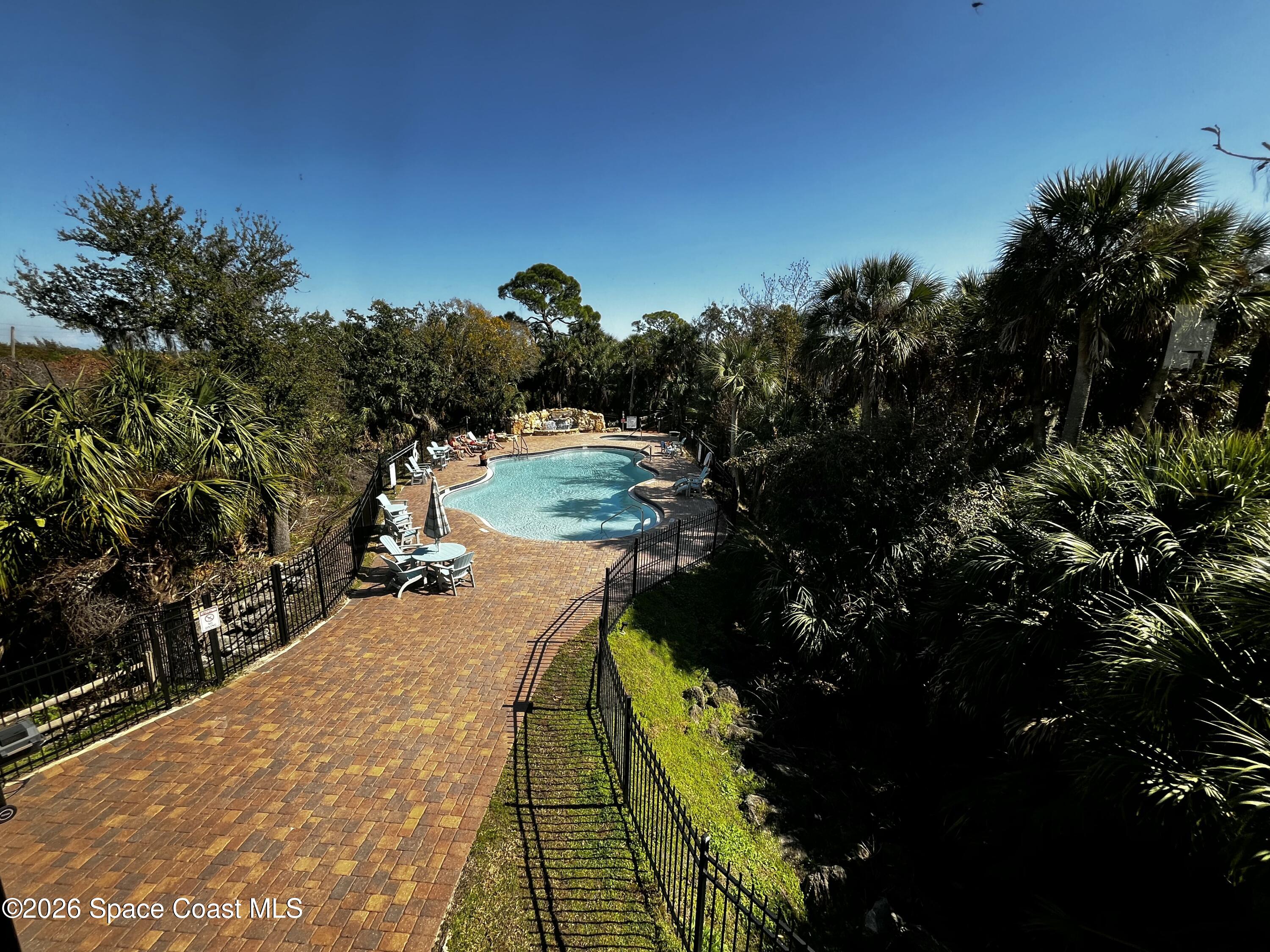 735 Pilot Lane, Unit 503 Merritt Island, FL 32952 - Photo 17 of 26 a view of swimming pool from a outdoor space