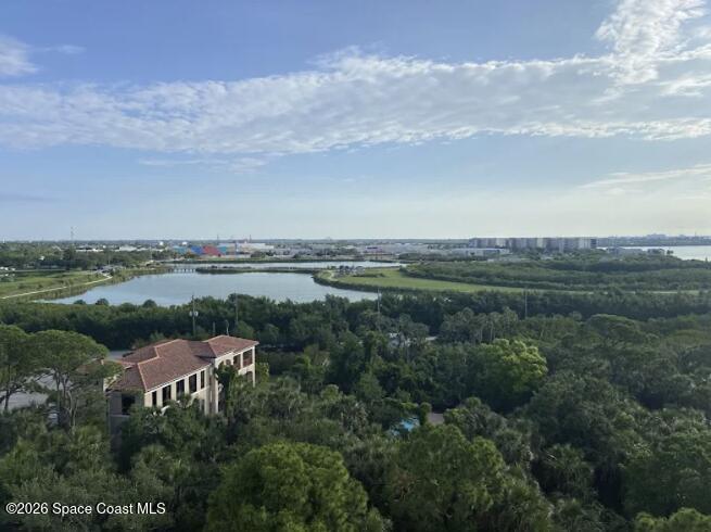 735 Pilot Lane, Unit 503 Merritt Island, FL 32952 - Photo 23 of 26 a view of a lake with houses in back