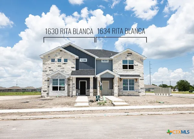 a view of a building with a street