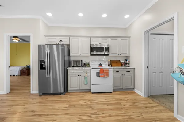 a view of kitchen with wooden floor