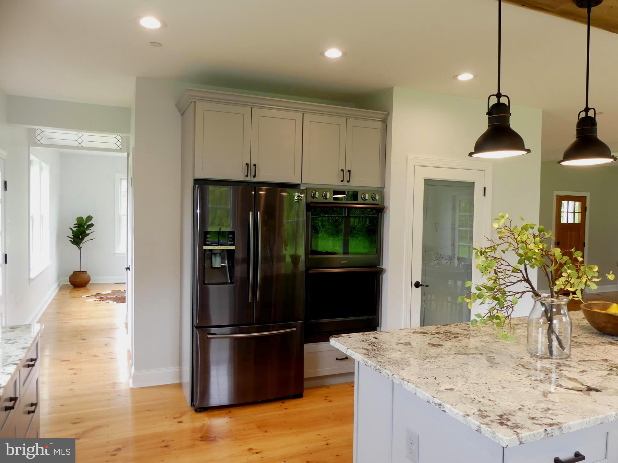 5156 Byerly Road Upperco, MD 21155 - Photo 8 of 35 a kitchen with stainless steel appliances granite countertop a refrigerator and a sink