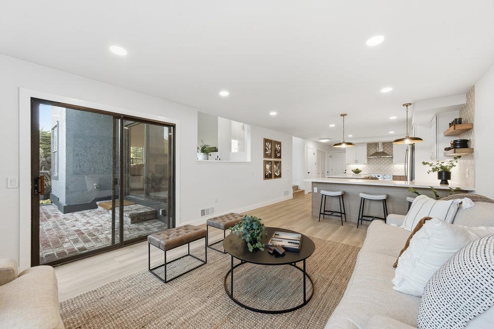 370 Burning Tree Court Half Moon Bay, CA 94019 - Photo 14 of 47 a living room with furniture and a table