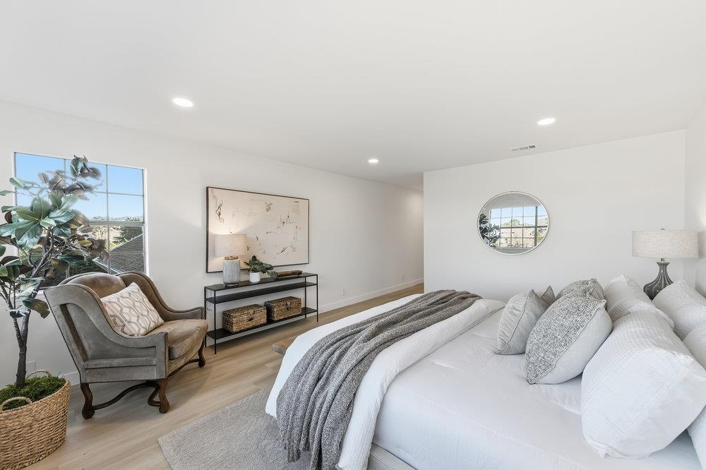 370 Burning Tree Court Half Moon Bay, CA 94019 - Photo 21 of 47 a bedroom with bed and a couch