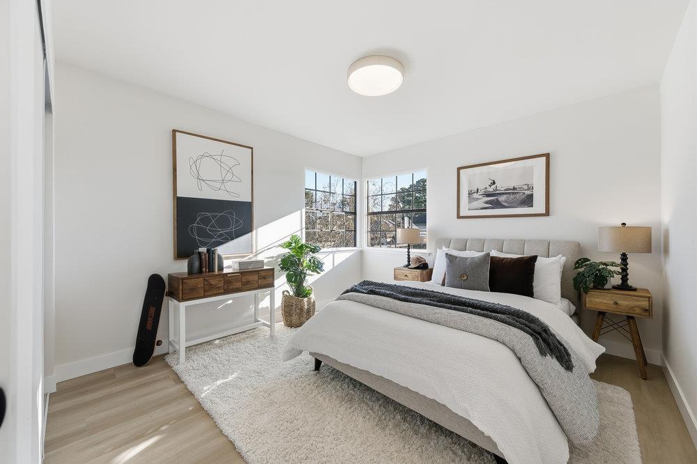 370 Burning Tree Court Half Moon Bay, CA 94019 - Photo 27 of 47 a bed room with a bed and a painting on the wall