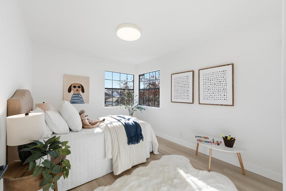 370 Burning Tree Court Half Moon Bay, CA 94019 - Photo 29 of 47 a bedroom with bed and a window