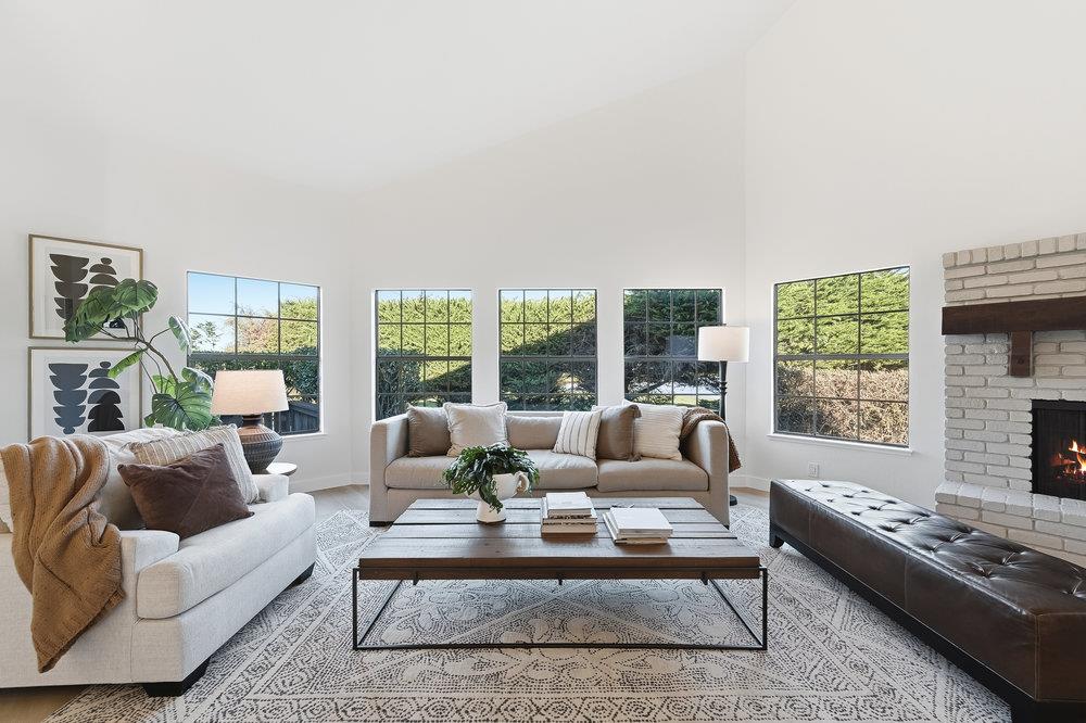 370 Burning Tree Court Half Moon Bay, CA 94019 - Photo 3 of 47 a living room with furniture large windows and wooden floor