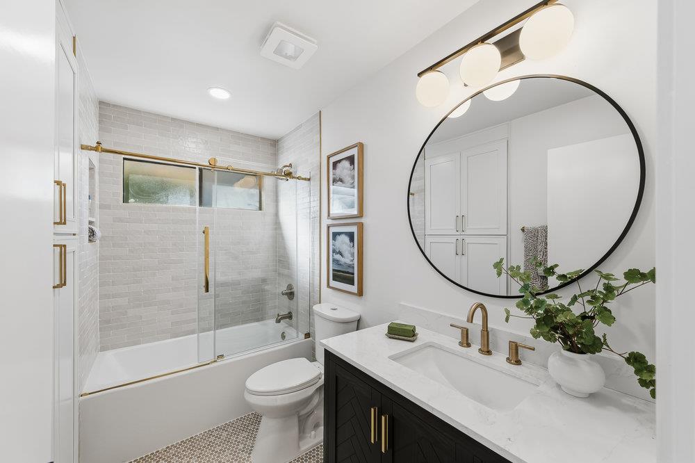 370 Burning Tree Court Half Moon Bay, CA 94019 - Photo 31 of 47 a bathroom with a sink a toilet and a mirror