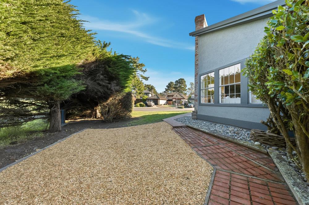 370 Burning Tree Court Half Moon Bay, CA 94019 - Photo 40 of 47 a front view of a house with a yard and trees