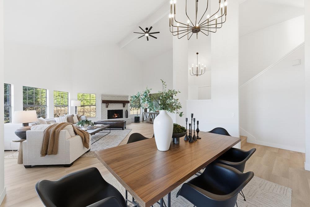 370 Burning Tree Court Half Moon Bay, CA 94019 - Photo 5 of 47 a living room with furniture fireplace and a flat screen tv