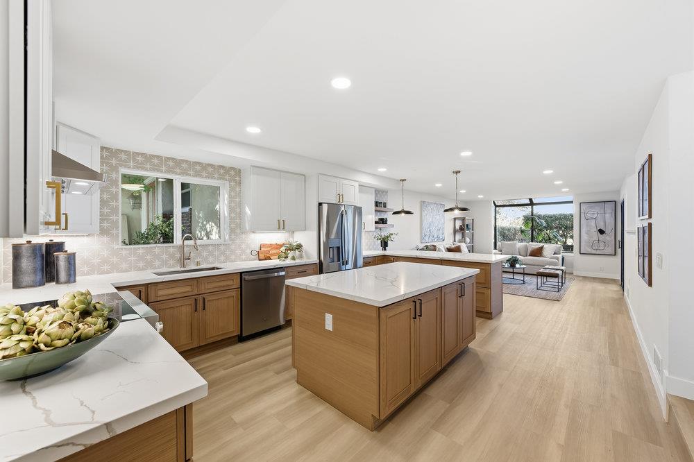 370 Burning Tree Court Half Moon Bay, CA 94019 - Photo 8 of 47 a large kitchen with stainless steel appliances lots of counter top space