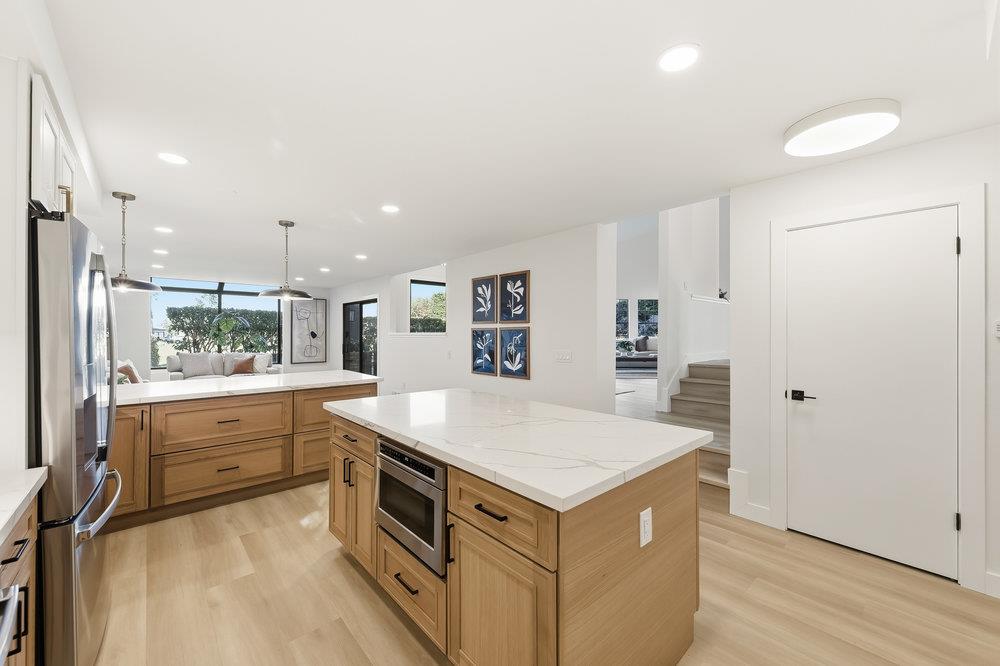 370 Burning Tree Court Half Moon Bay, CA 94019 - Photo 10 of 47 a kitchen with a stove a refrigerator and a sink
