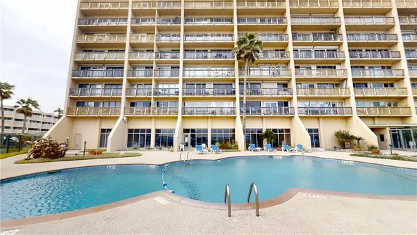 a view of a water fountain and a building