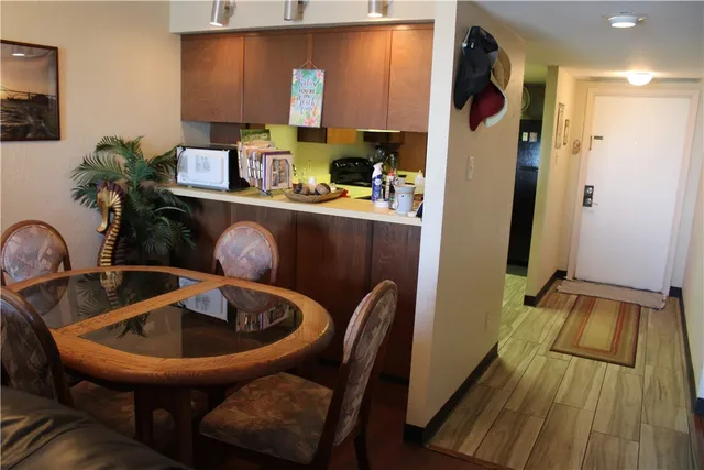 a room with wooden floor and furniture