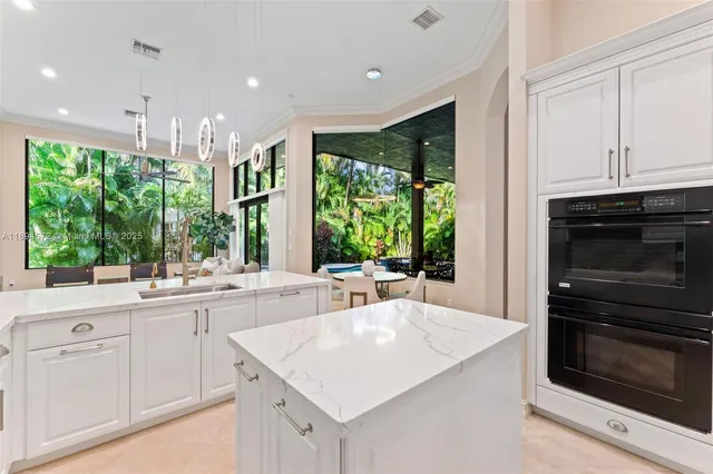 a kitchen with a sink stove and cabinets