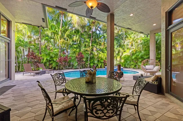 a outdoor dining space with furniture and garden view