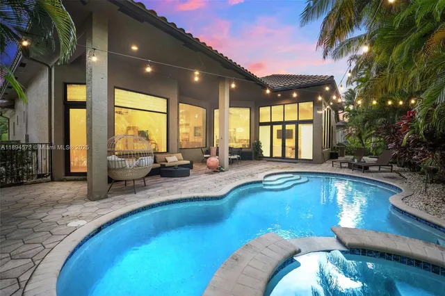 a view of a swimming pool with a patio