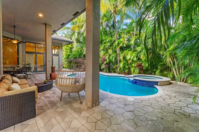 a patio with yard table and chairs