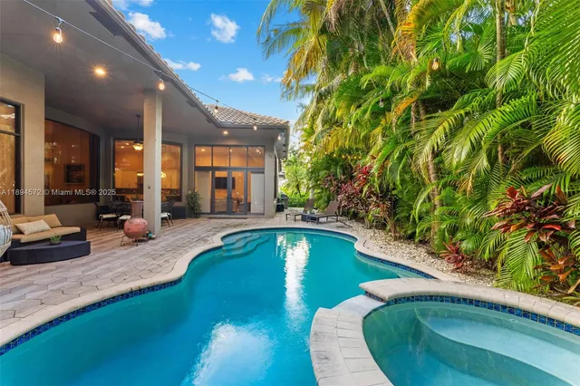 a view of a house with swimming pool