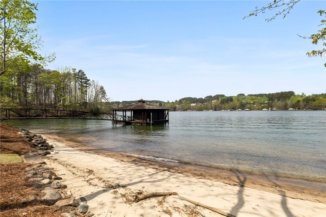 195 Village View Drive Sunset, SC 29685 - Photo 44 of 48 This serene lakefront property offers tranquil waters and a charming boathouse for endless relaxation.
