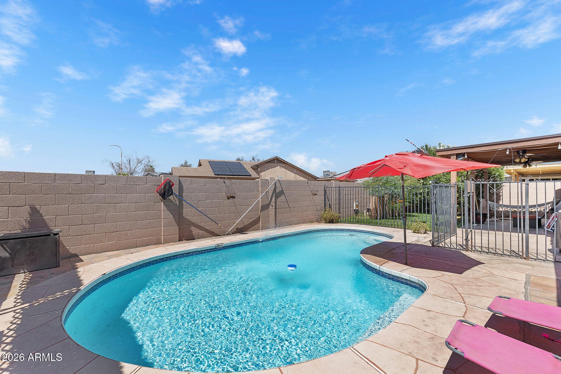 9002 West Coronado Road Phoenix, AZ 85037 - Photo 50 of 54 a view of a swimming pool with a patio