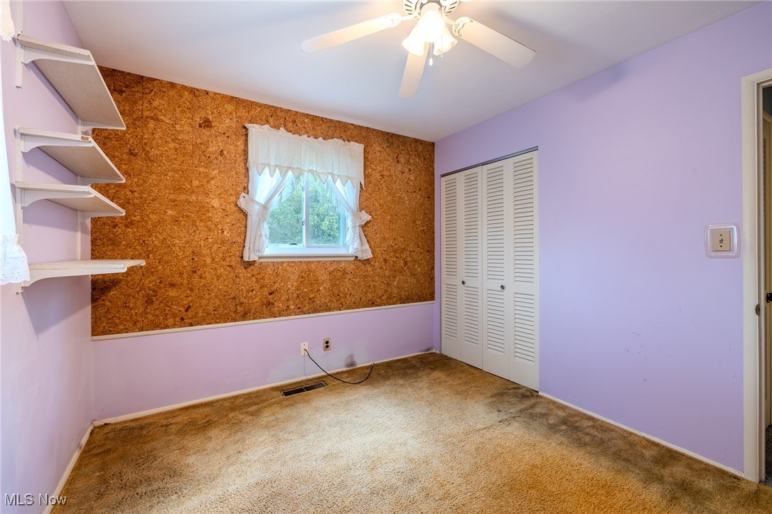 8226 Cedar Road Chesterland, OH 44026 - Photo 37 of 46 Unfurnished bedroom with a closet, carpet floors, and a ceiling fan