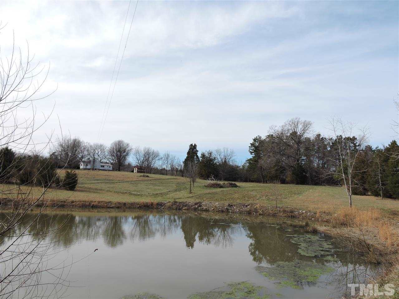 8320 Bacon Road Timberlake, NC 27583 - Photo 13 of 21 a view of a lake with houses in the back