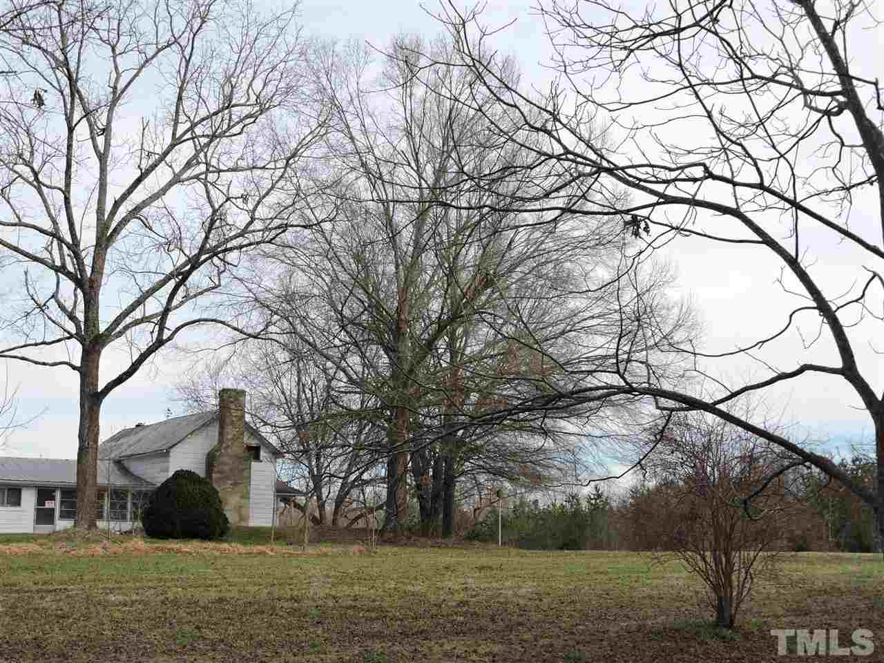 8320 Bacon Road Timberlake, NC 27583 - Photo 4 of 21 a view of outdoor space with lots of trees