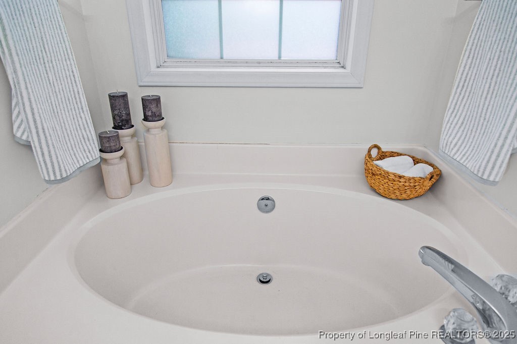 330 Fox Run Road Pinehurst, NC 28374 - Photo 26 of 31 a bathroom with a tub
