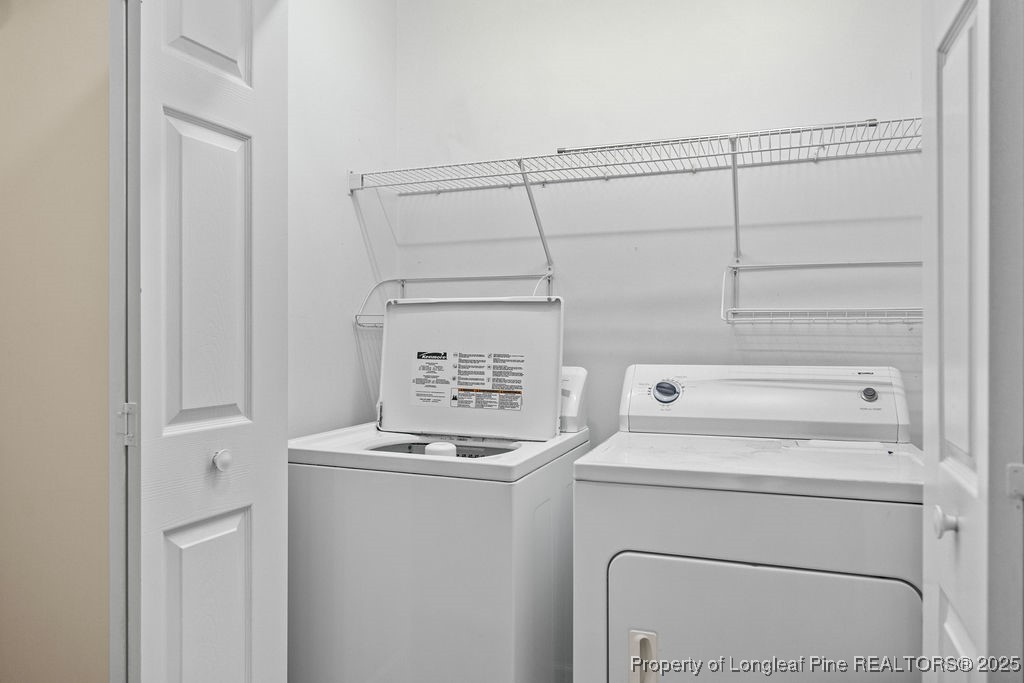 330 Fox Run Road Pinehurst, NC 28374 - Photo 27 of 31 a utility room with dryer and washer