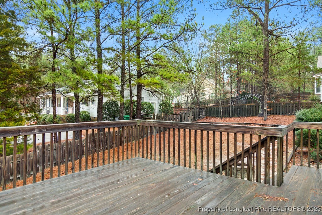 330 Fox Run Road Pinehurst, NC 28374 - Photo 28 of 31 a balcony with wooden floor and fence