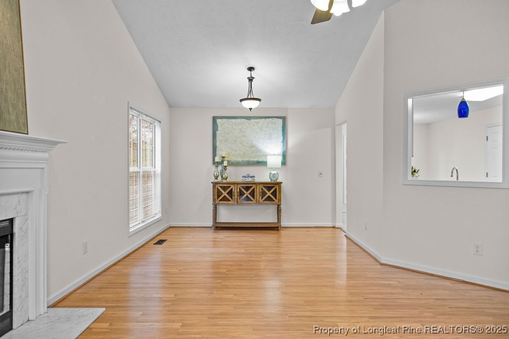 330 Fox Run Road Pinehurst, NC 28374 - Photo 6 of 31 a view of an empty room with wooden floor and a window