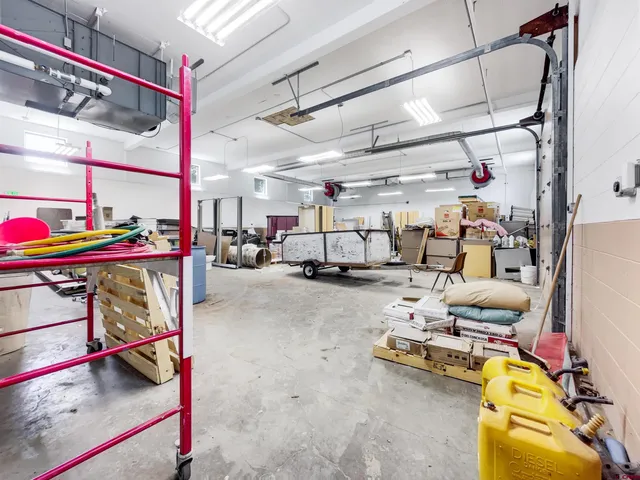 a bedroom with furniture and white walls
