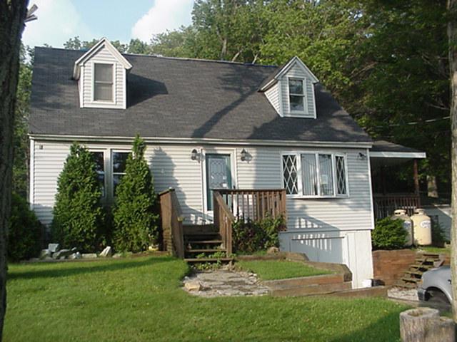 4247 Rte 307 Moscow Pa Moscow, PA 18444 - Photo 1 of 1 a view of a house with a yard
