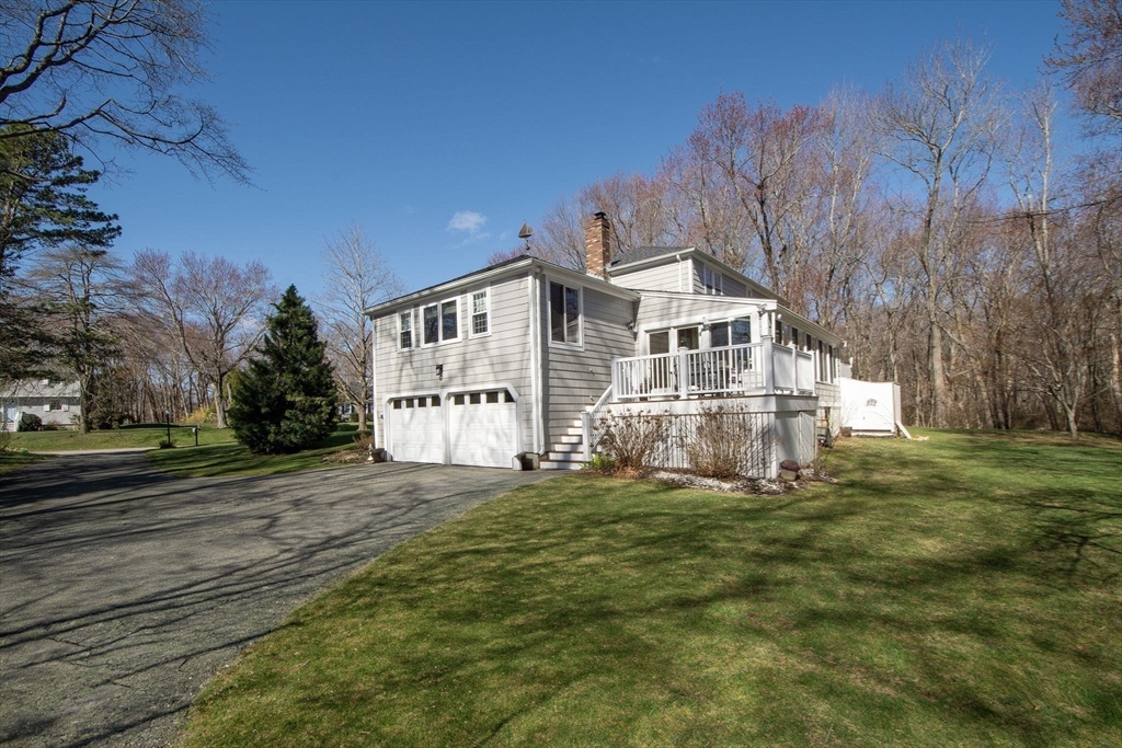 18 Longmeadow Road Scituate, MA 02066 - Photo 35 of 37 a front view of a house with a yard