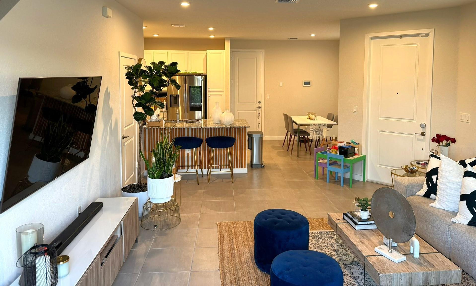 10957 Southwest 232nd Terrace Homestead, FL 33032 - Photo 5 of 11 a lobby with furniture and a flat screen tv