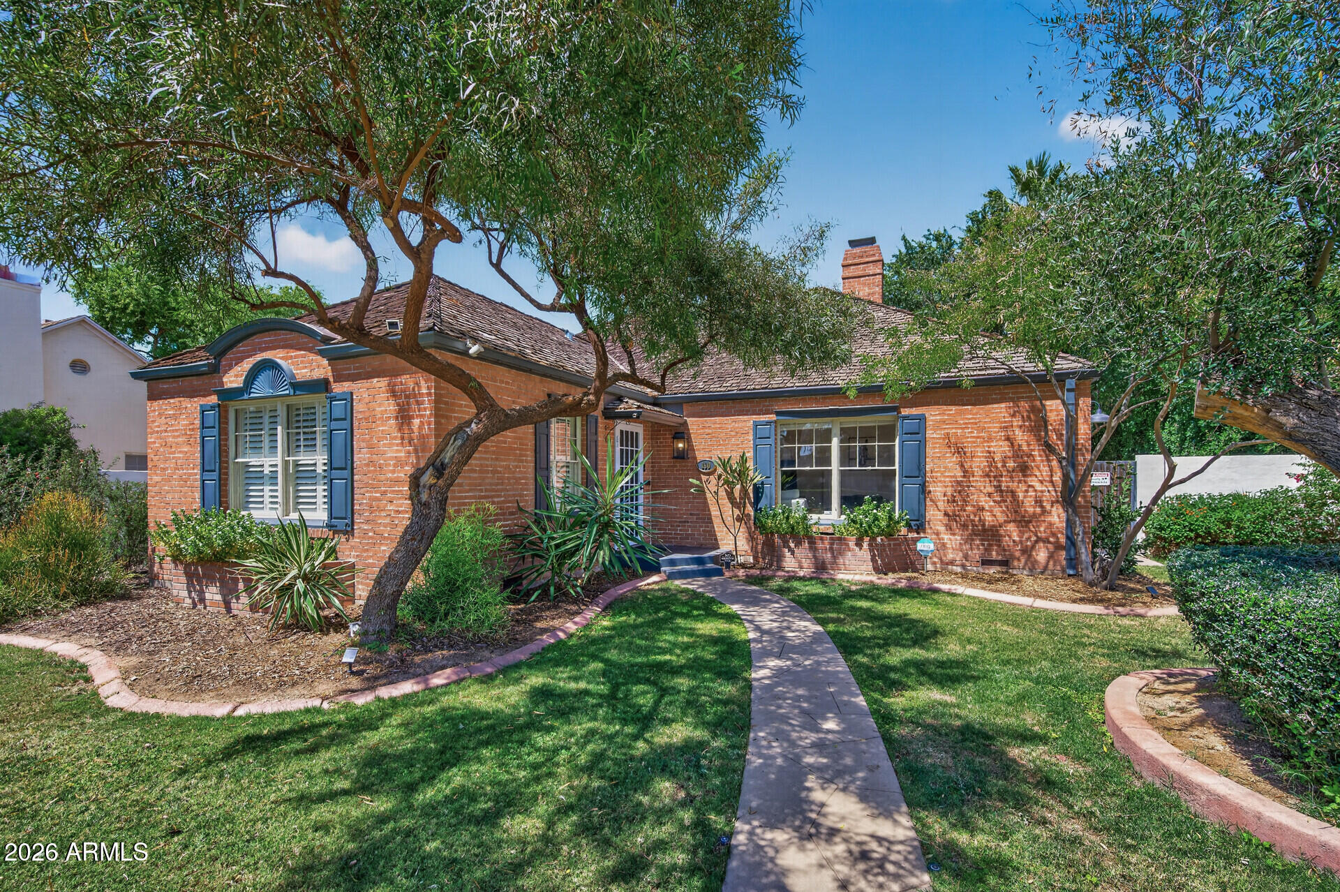130 East Alvarado Road Phoenix, AZ 85004 - Photo 1 of 49 a front view of a house with a yard and potted plants