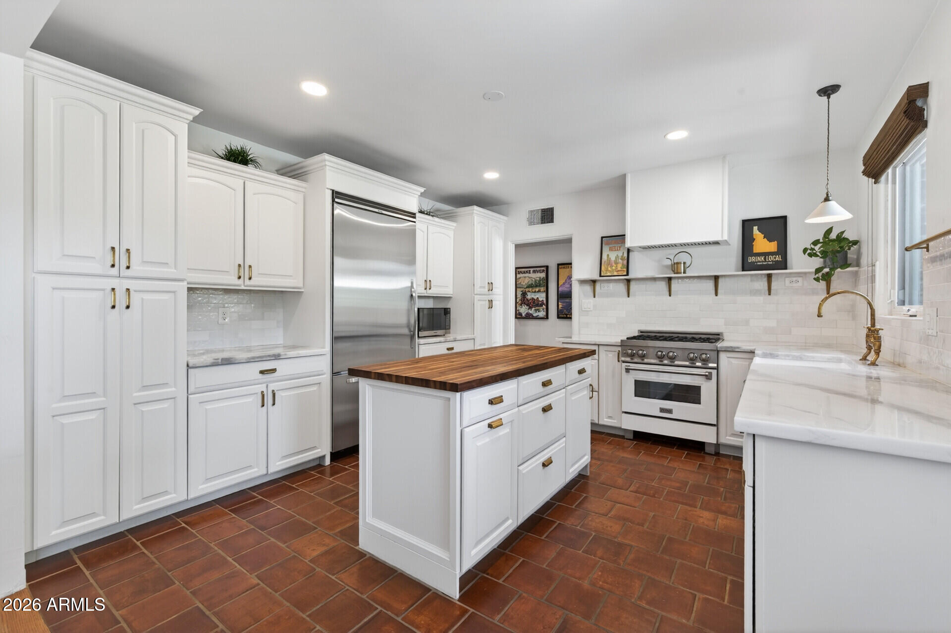 130 East Alvarado Road Phoenix, AZ 85004 - Photo 15 of 49 a kitchen with granite countertop a sink stove and refrigerator