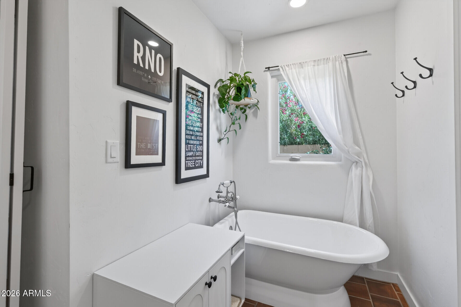 130 East Alvarado Road Phoenix, AZ 85004 - Photo 27 of 49 a bathroom with a sink a toilet and a window