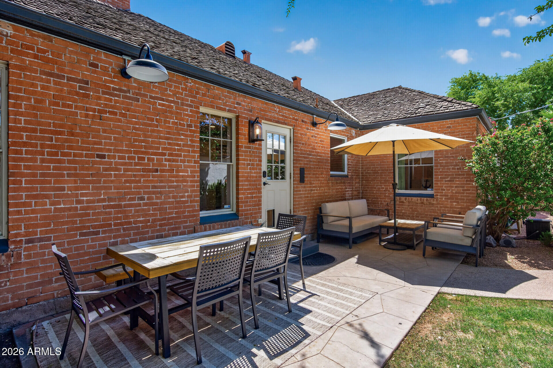 130 East Alvarado Road Phoenix, AZ 85004 - Photo 36 of 49 a backyard of a house with barbeque oven table and chairs