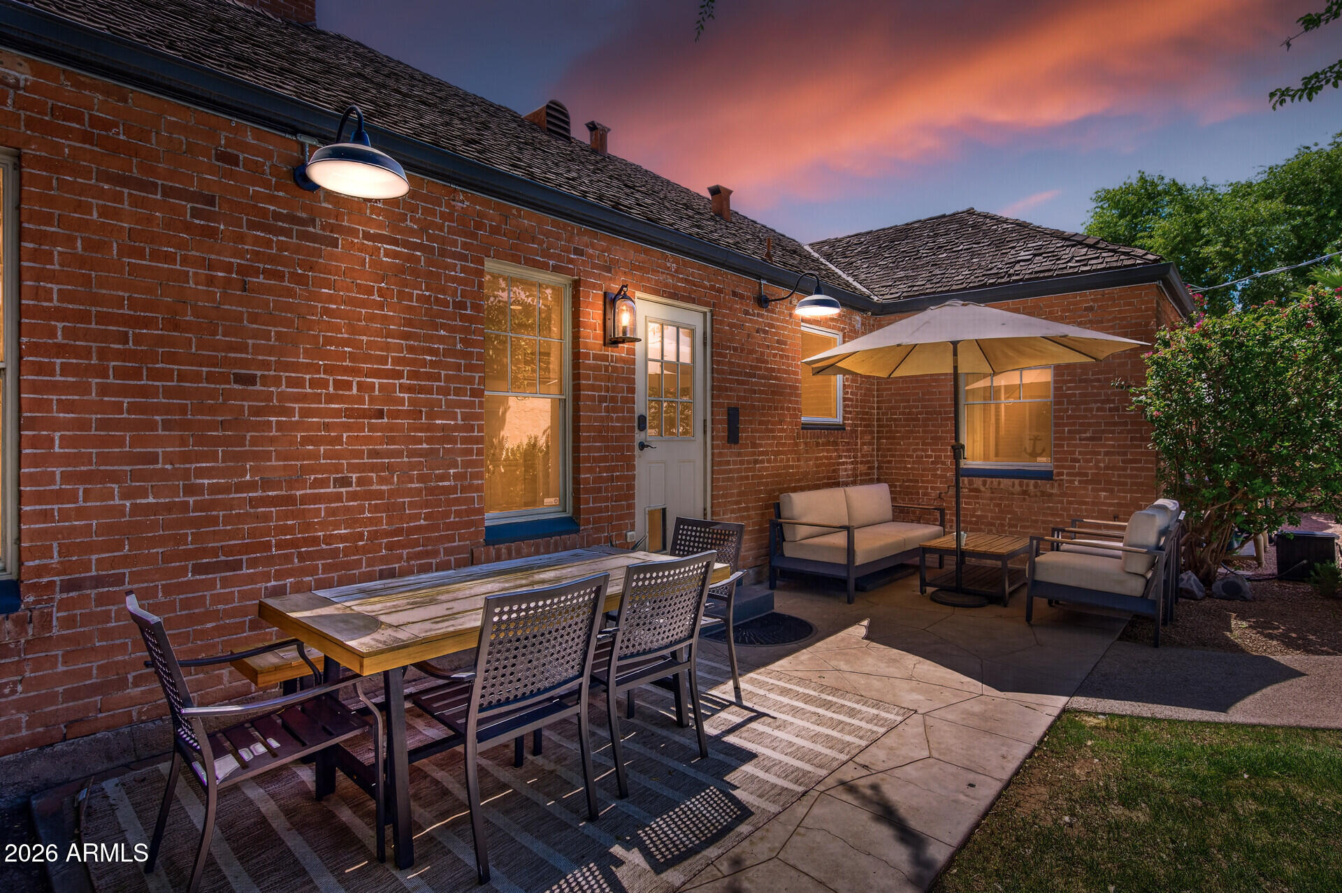 130 East Alvarado Road Phoenix, AZ 85004 - Photo 37 of 49 a backyard of a house with barbeque oven table and chairs