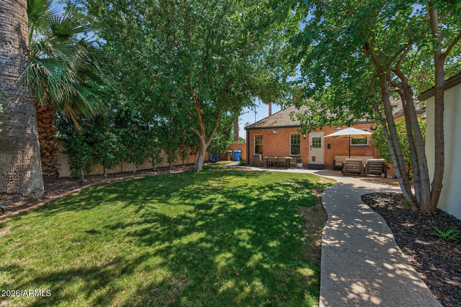 130 East Alvarado Road Phoenix, AZ 85004 - Photo 41 of 49 a front view of a house with garden