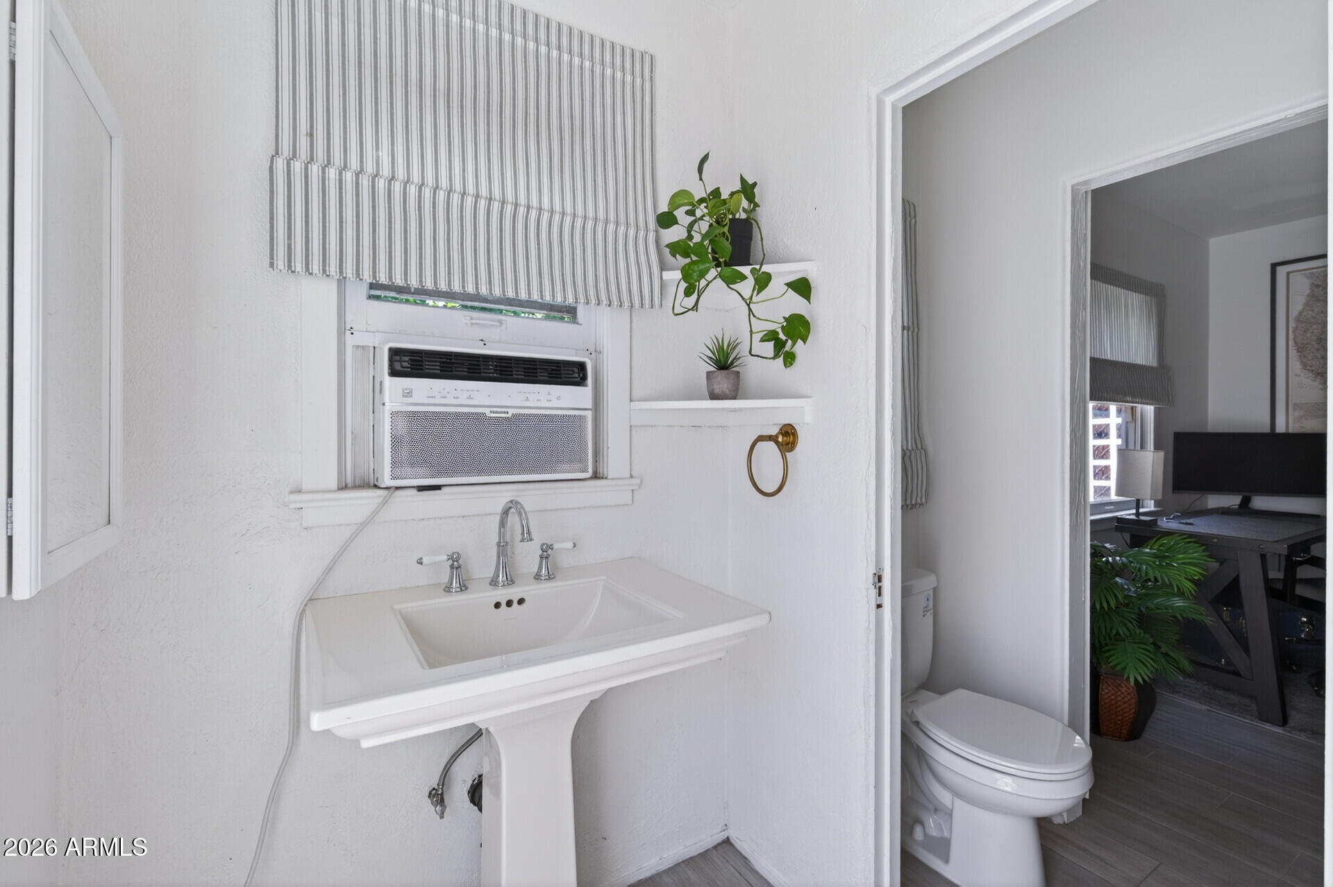 130 East Alvarado Road Phoenix, AZ 85004 - Photo 45 of 49 a bathroom with a sink toilet and shower