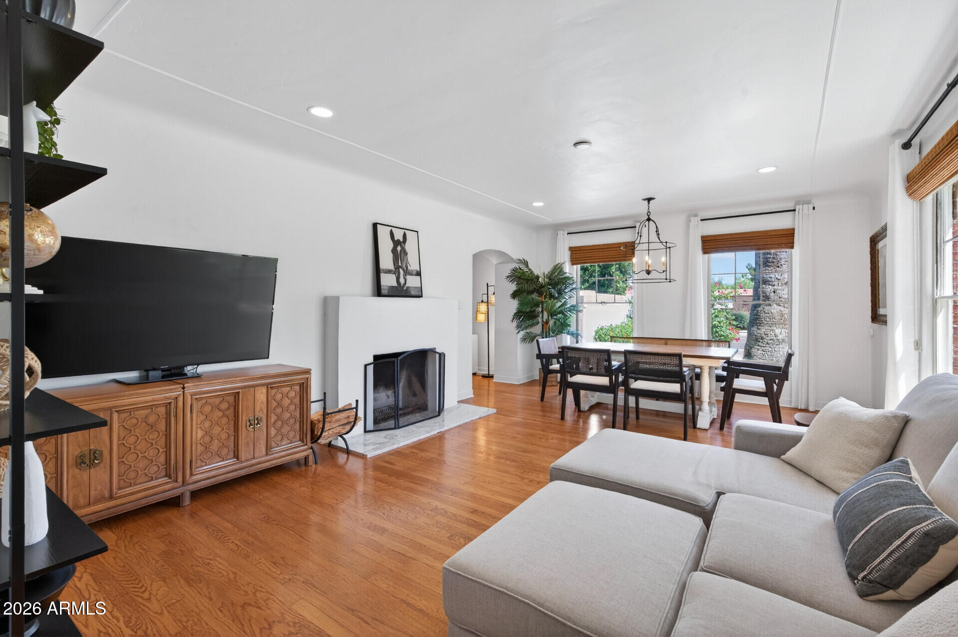 130 East Alvarado Road Phoenix, AZ 85004 - Photo 6 of 49 a living room with furniture a fireplace and a flat screen tv