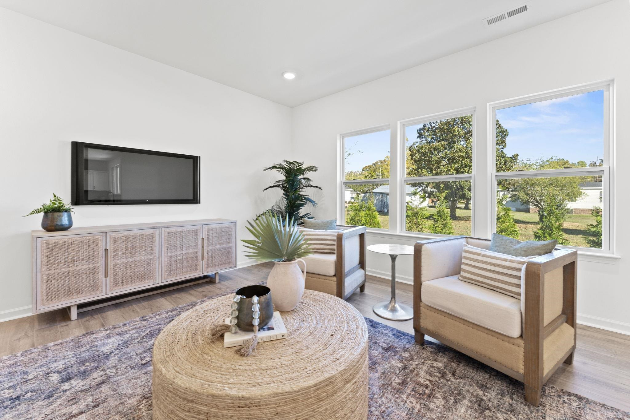 402 Cliff Court, Unit 9 Benson, NC 27504 - Photo 12 of 25 a living room with furniture and a flat screen tv