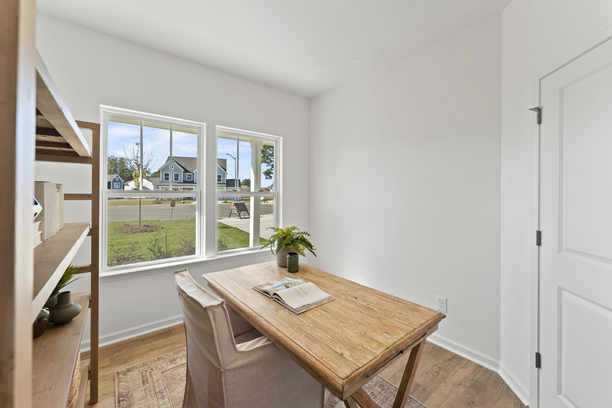 402 Cliff Court, Unit 9 Benson, NC 27504 - Photo 13 of 25 a view of a workspace with furniture and a window