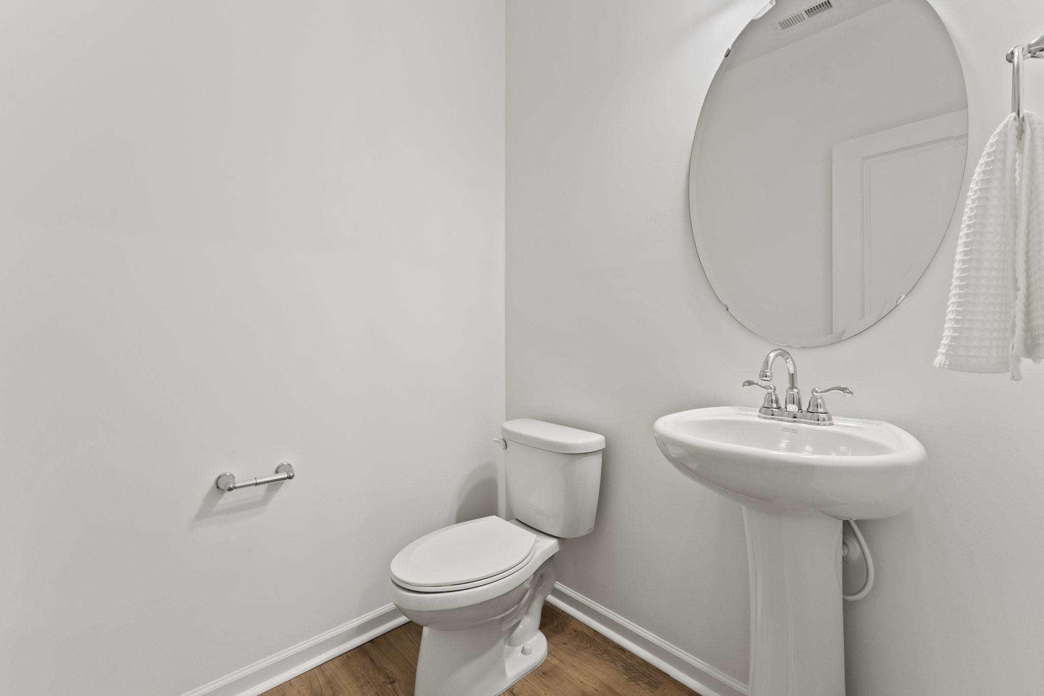 402 Cliff Court, Unit 9 Benson, NC 27504 - Photo 14 of 25 a bathroom with a sink toilet and a mirror