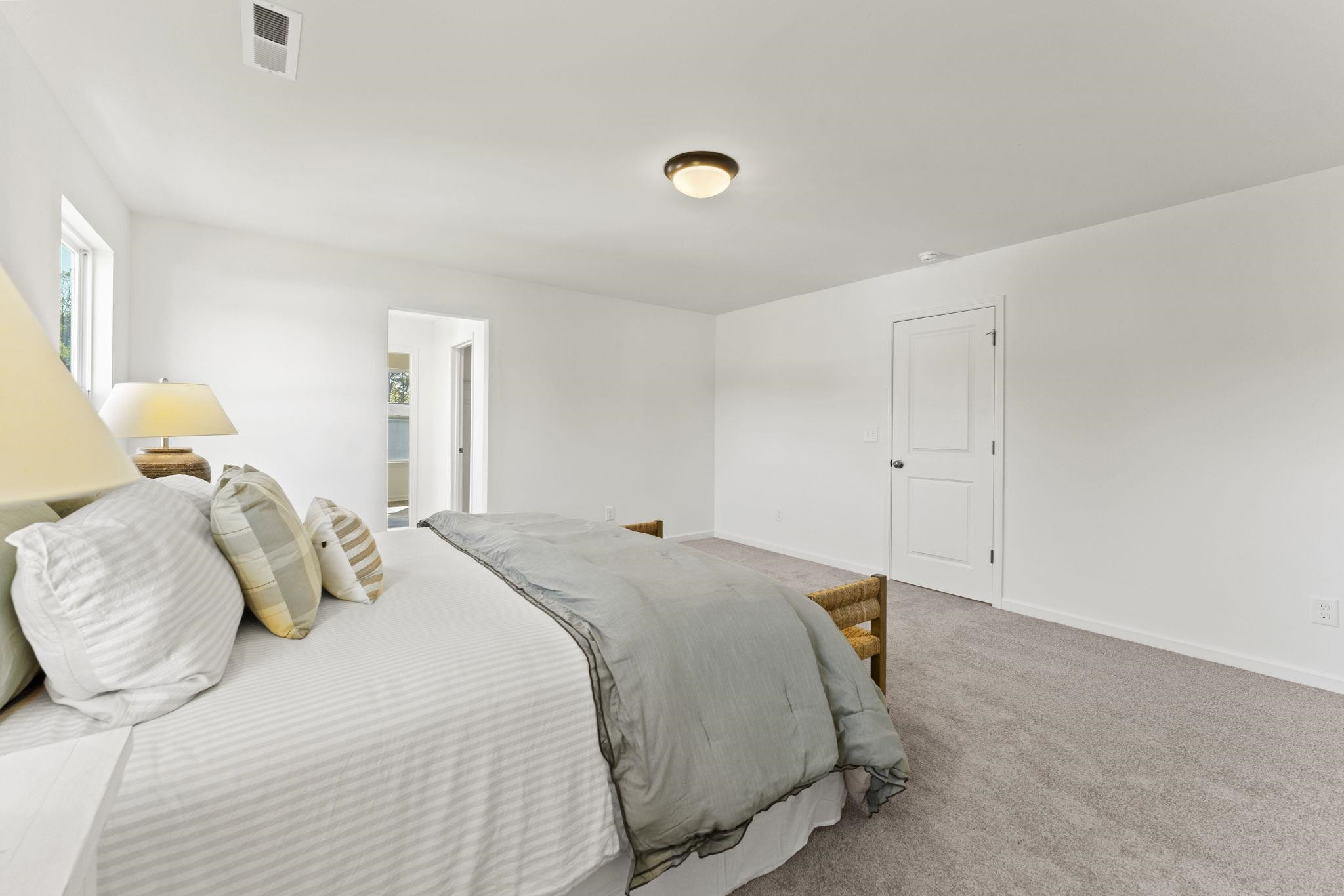 402 Cliff Court, Unit 9 Benson, NC 27504 - Photo 16 of 25 a bedroom with a bed and a window