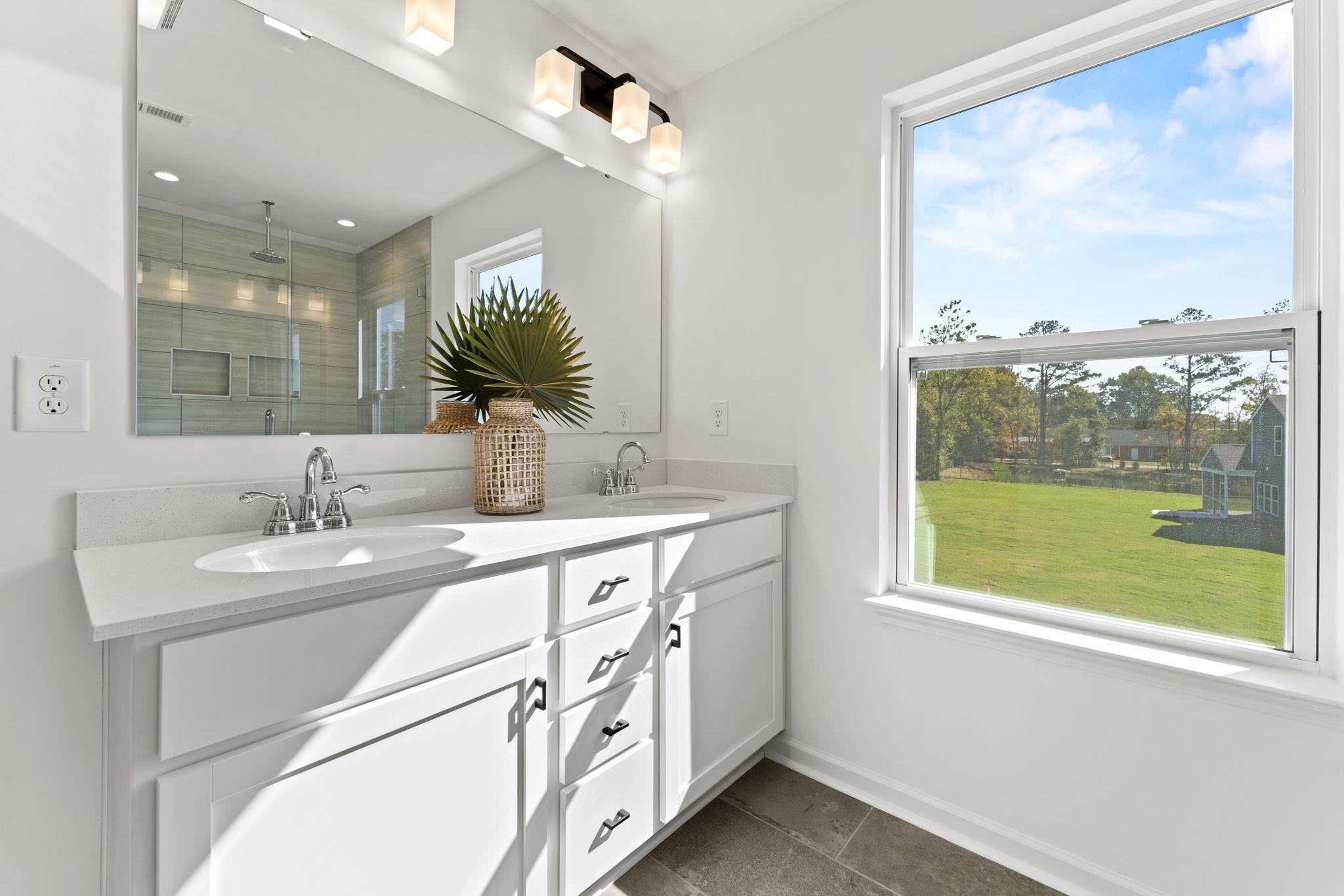 402 Cliff Court, Unit 9 Benson, NC 27504 - Photo 19 of 25 a bathroom with a double vanity sink a mirror and a shower
