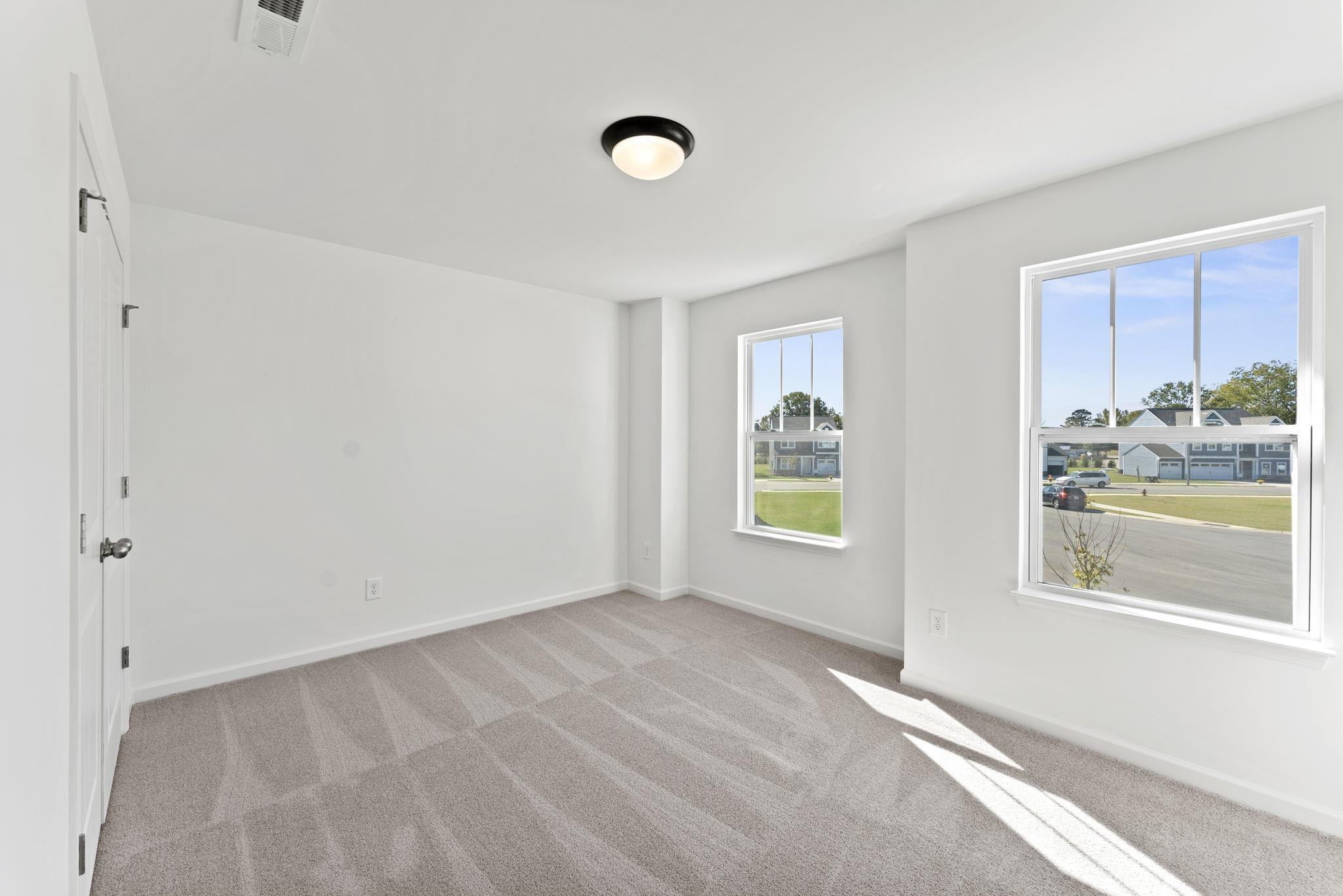 402 Cliff Court, Unit 9 Benson, NC 27504 - Photo 22 of 25 a view of an empty room with a window