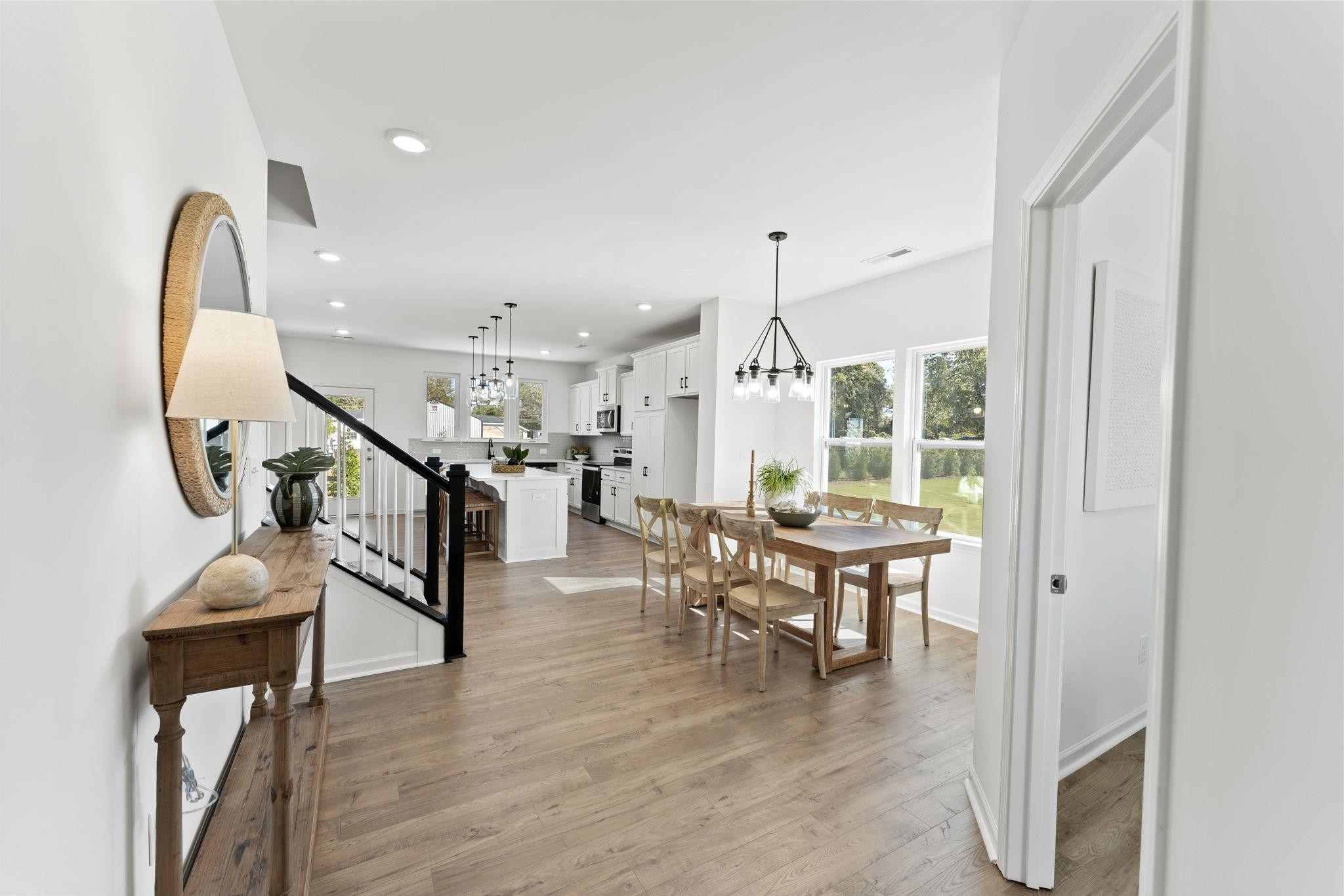 402 Cliff Court, Unit 9 Benson, NC 27504 - Photo 8 of 25 a view of a dining room with furniture window and wooden floor